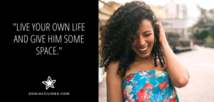 woman laughing and looking down with a quote about living your own life to get an aquarius man to chase you