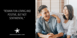 couple laughing on a couch with a quote about not getting overly emotional with aquarius men