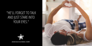 couple making heart shape with their hands on a bed with a quote about taurus men staring at you when they like you